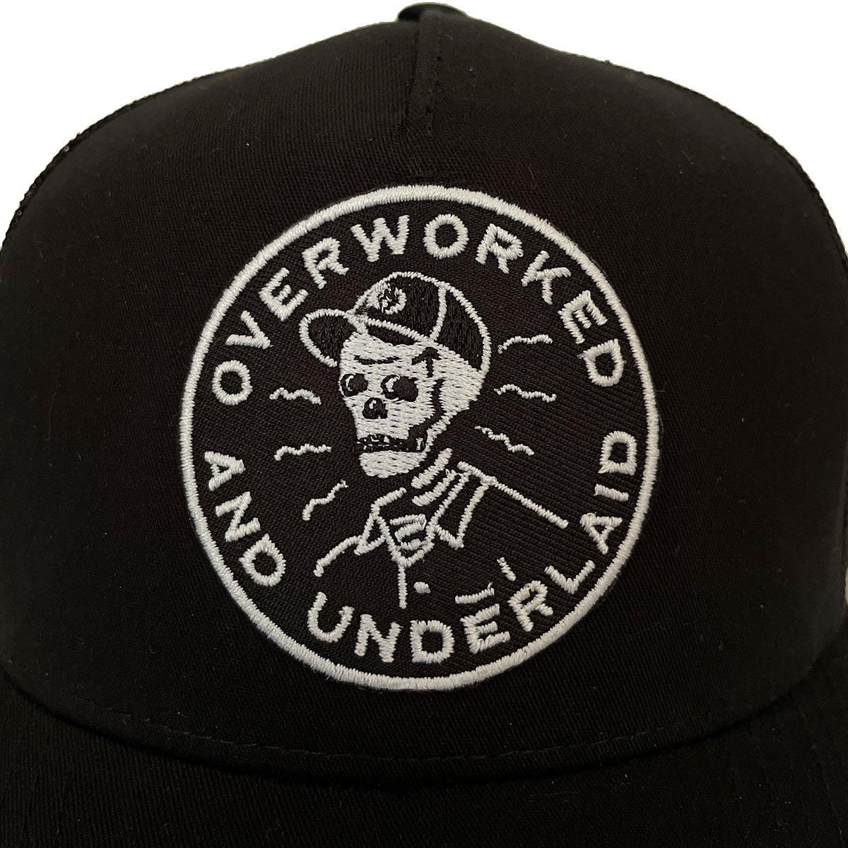 Overworked and Underlaid Trucker Hat